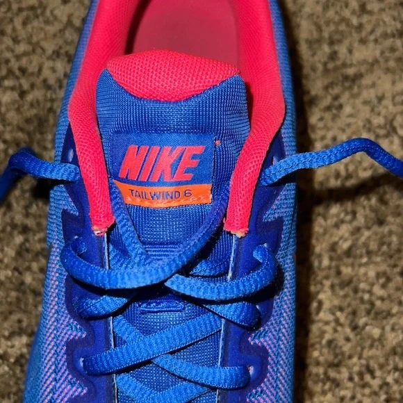 Nike Tail Wind 6 shoes and color is bright blue with orange and pink accents. - Picture 2 of 2